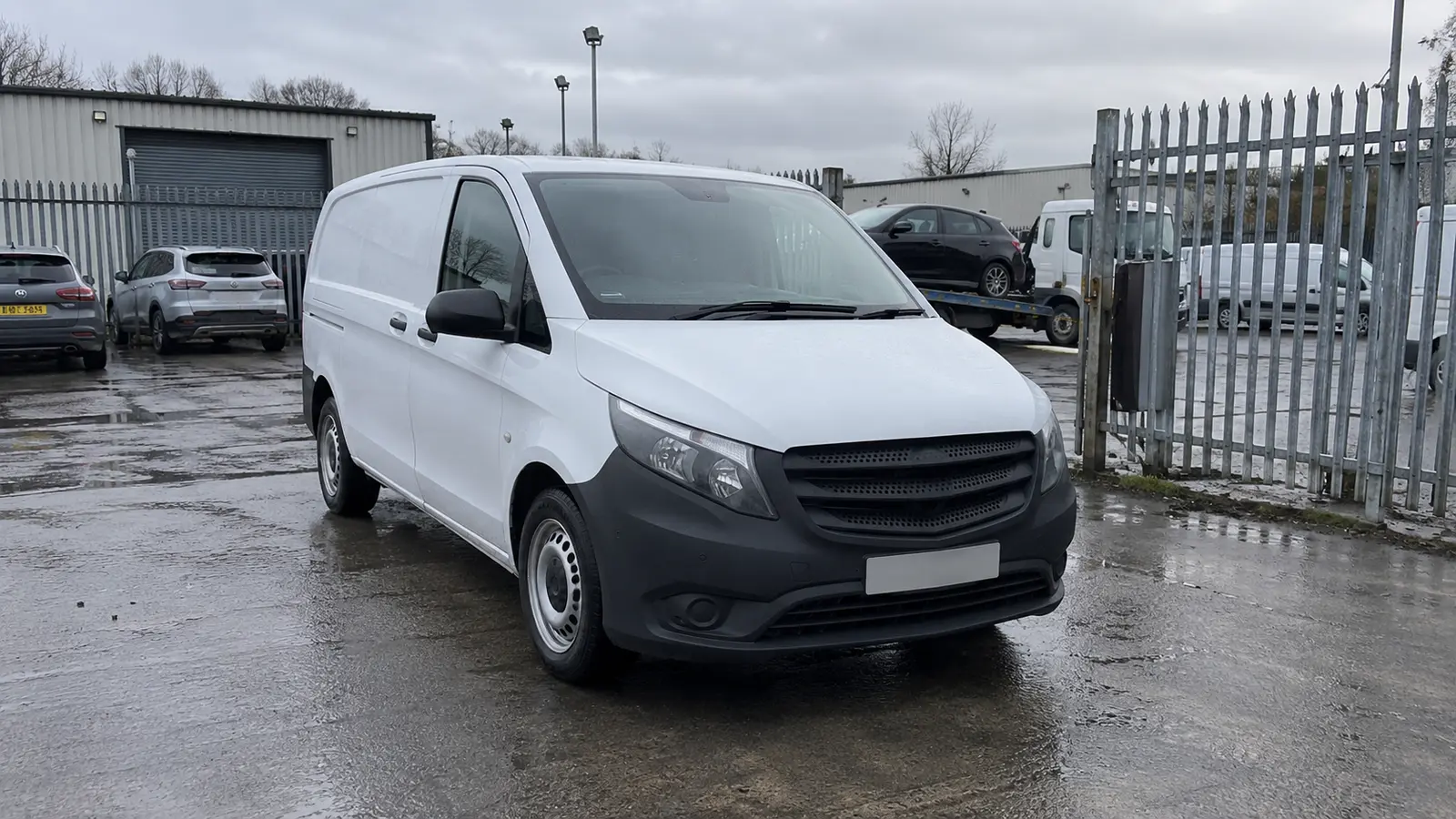 An unbranded van inside a UK vehicle compound